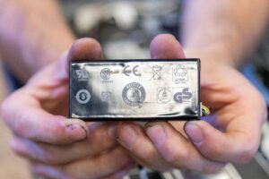 Person holding up a lithium polymer battery